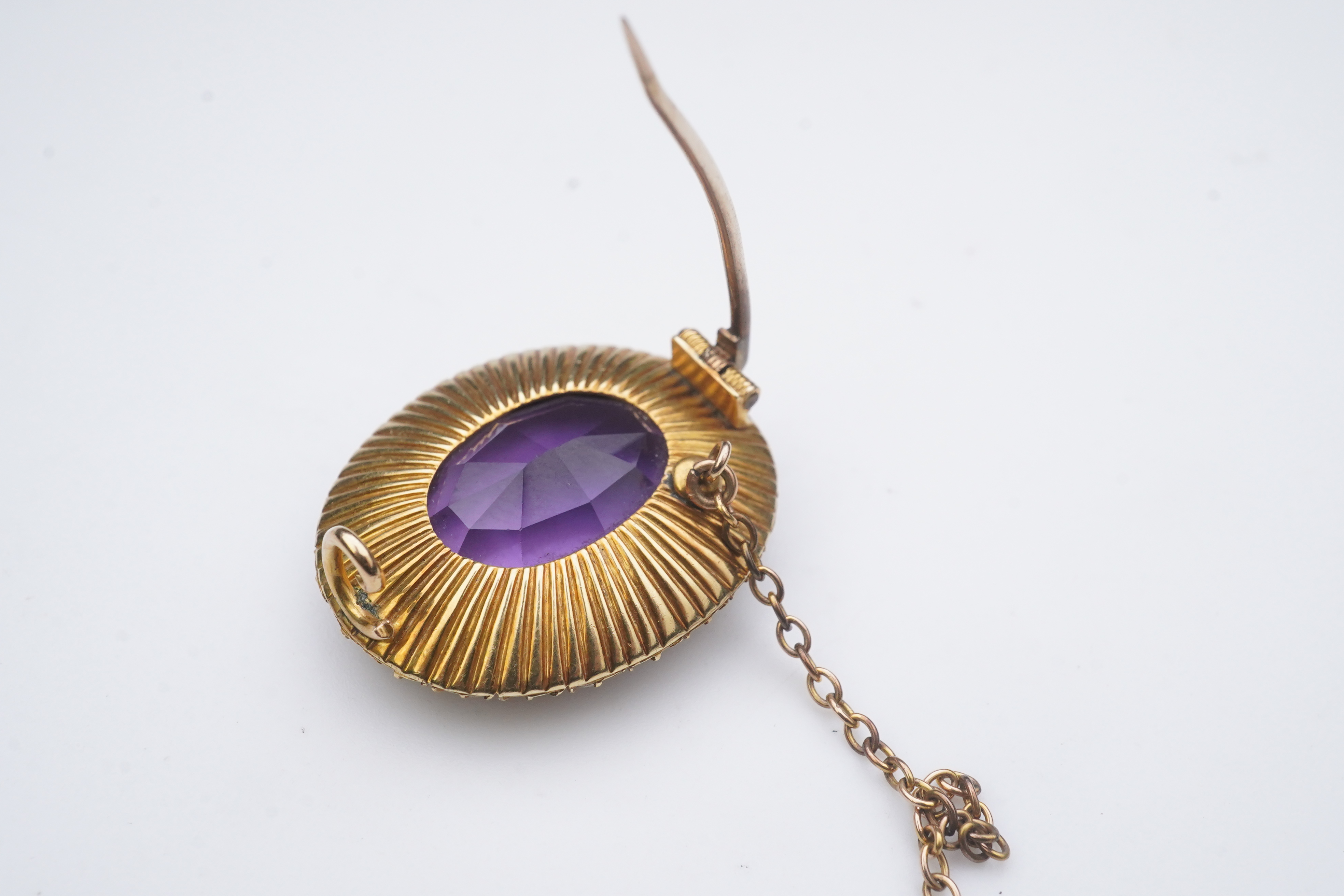 An amethyst and split pearl brooch, circa 1900